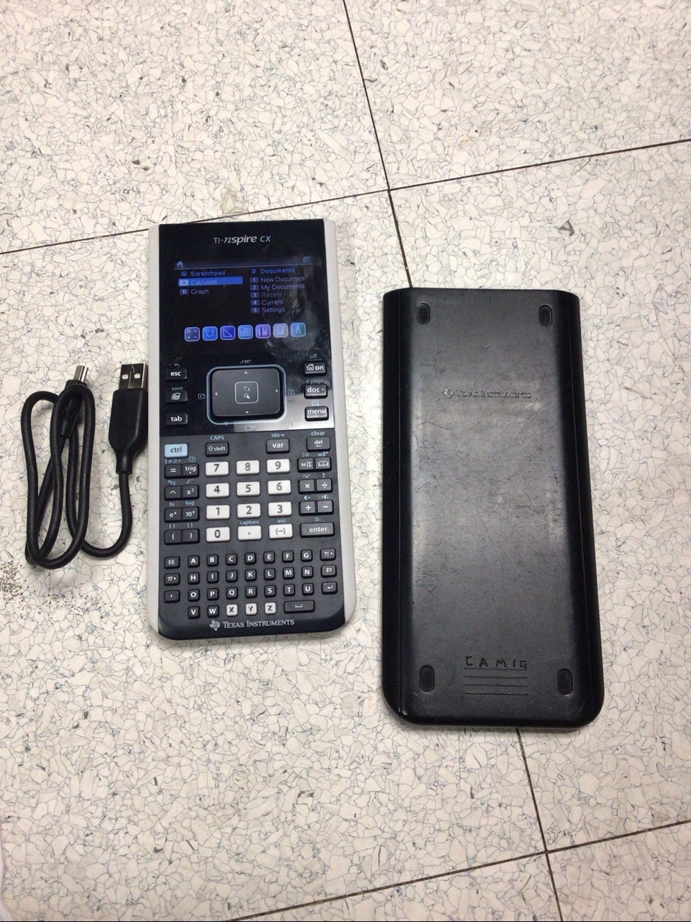 TI NSpire CX Color Graphing Calculator with USB Charging Cable.